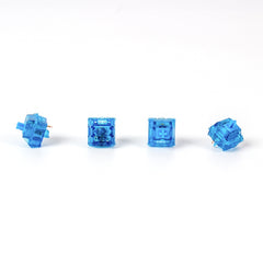 Close-up of Gateron Blue Ink V2 5-pin clicky mechanical keyboard switches with blue transparent housing